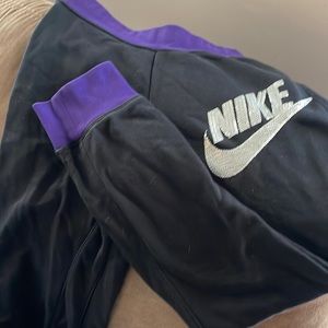 Purple/black Nike joggers girls size large.  Great condition.